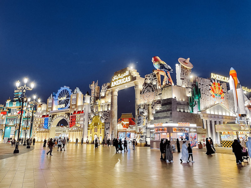 Global City in Dubai, with stands for Americas and Europe, and people walking 