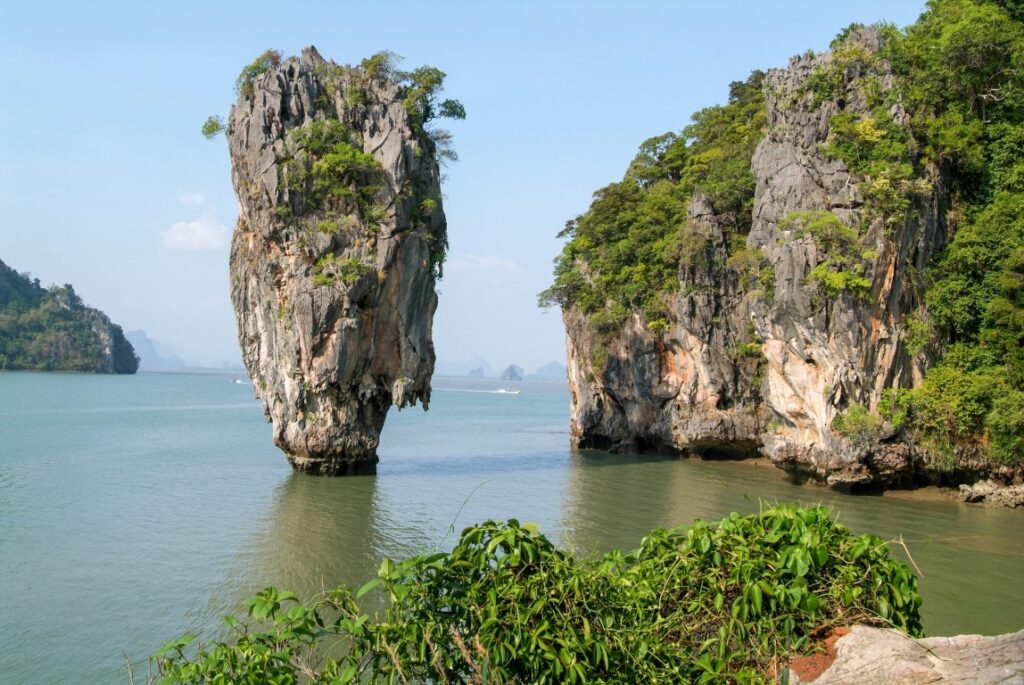 Limestone karsts in the water, covered in vegetation