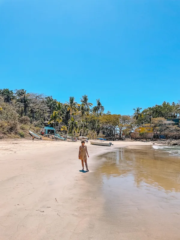 A woman on the shores of a beach 