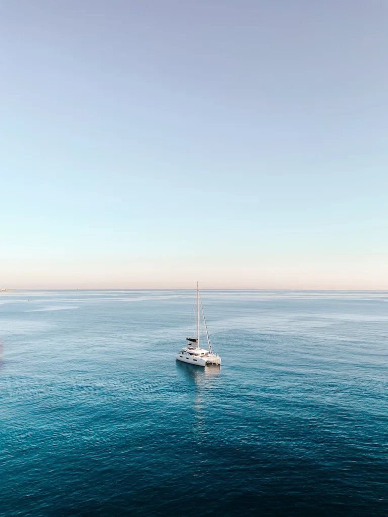 A white boat in the middle of the sea