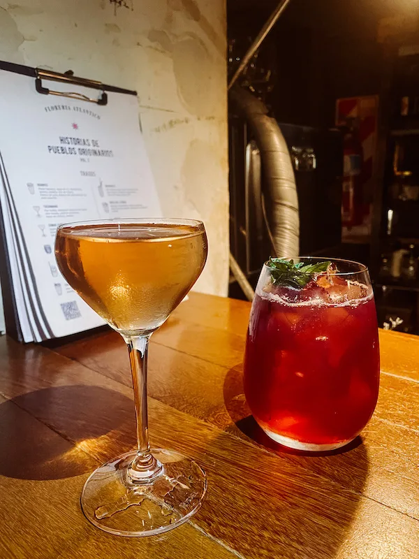 Two cocktail glasses on a wooden table