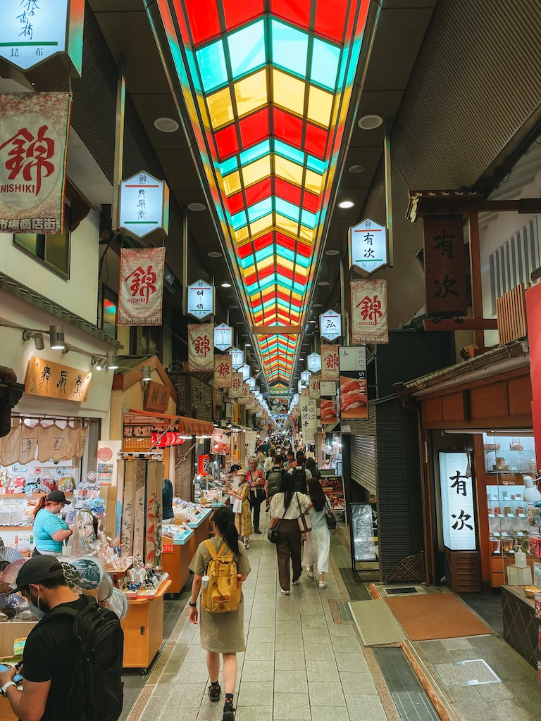 A covered alley lined by bustling shops