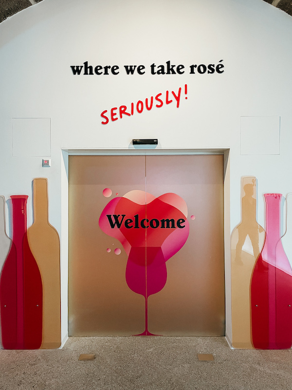 A wall painting with a sign that reads ''where we take rosé seriously''