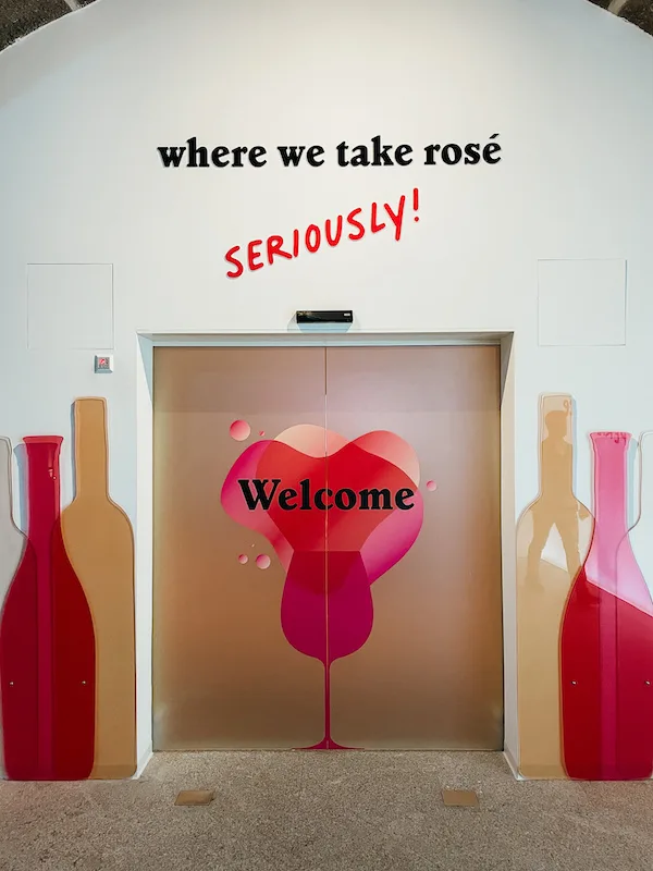 A wall painting with a sign that reads ''where we take rosé seriously''