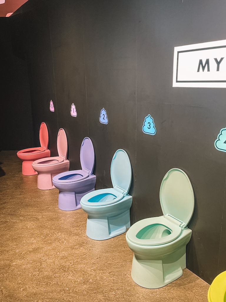 A row of colorful toilets