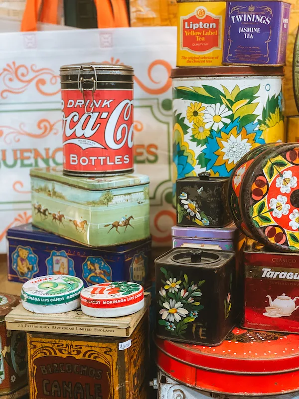 colorful tins of various brands and sizes 