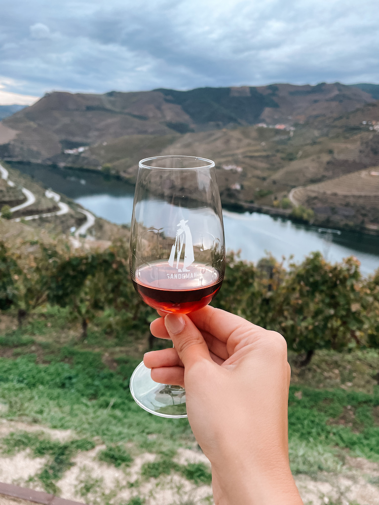 A woman's hand holding a wine glass