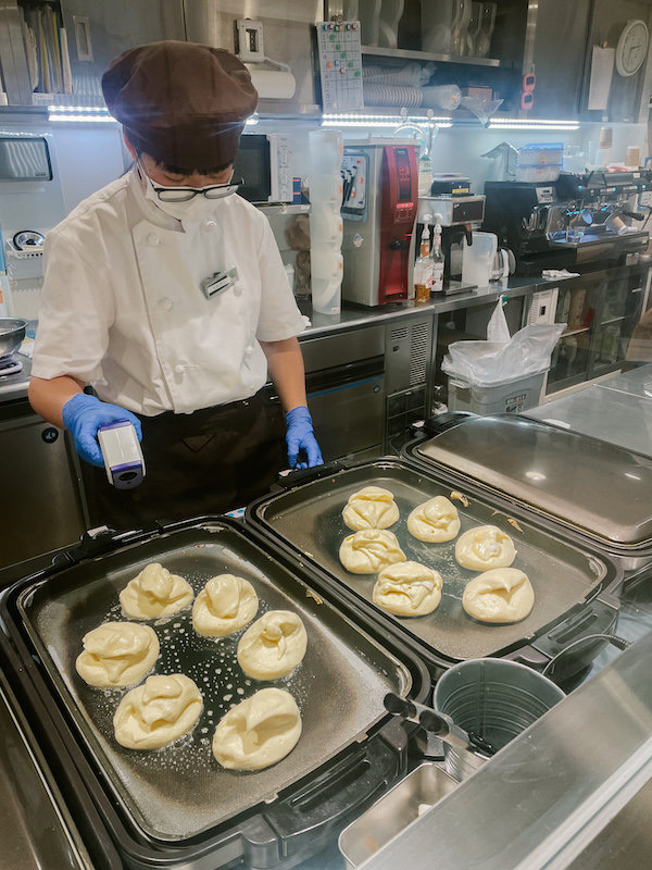 A cook making jiggly pancakes