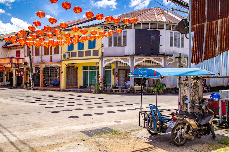 Colorful Sino-Portuguese houses in the center of Taka Pa, and Chinese lanterns in front of them.