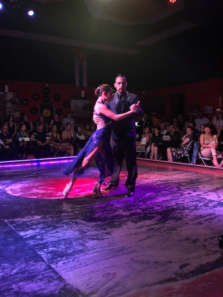 A couple dancing tango on stage