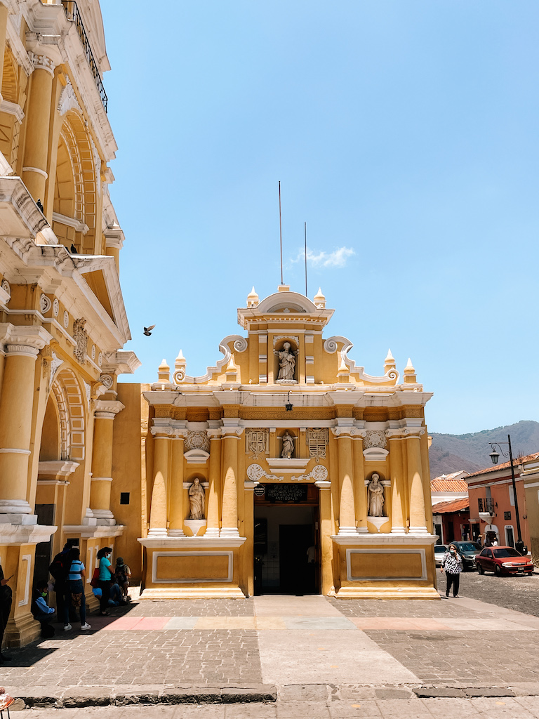 An intricate yellow facade with white details