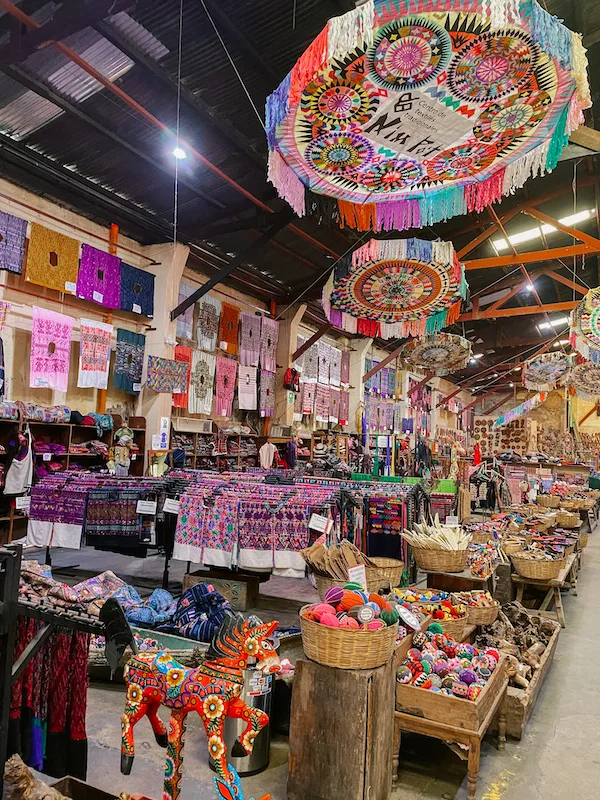 The interior of a colorful textile market