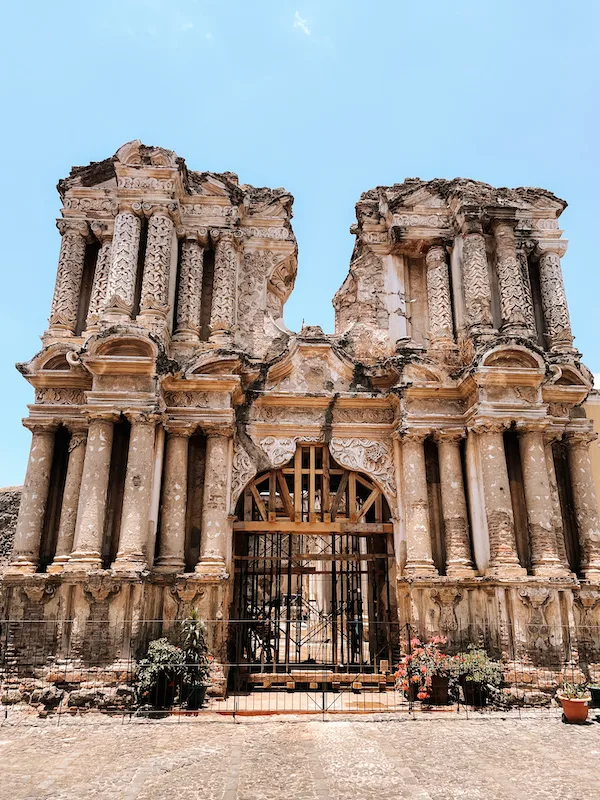 The ruins of a church's facade on a clear day 